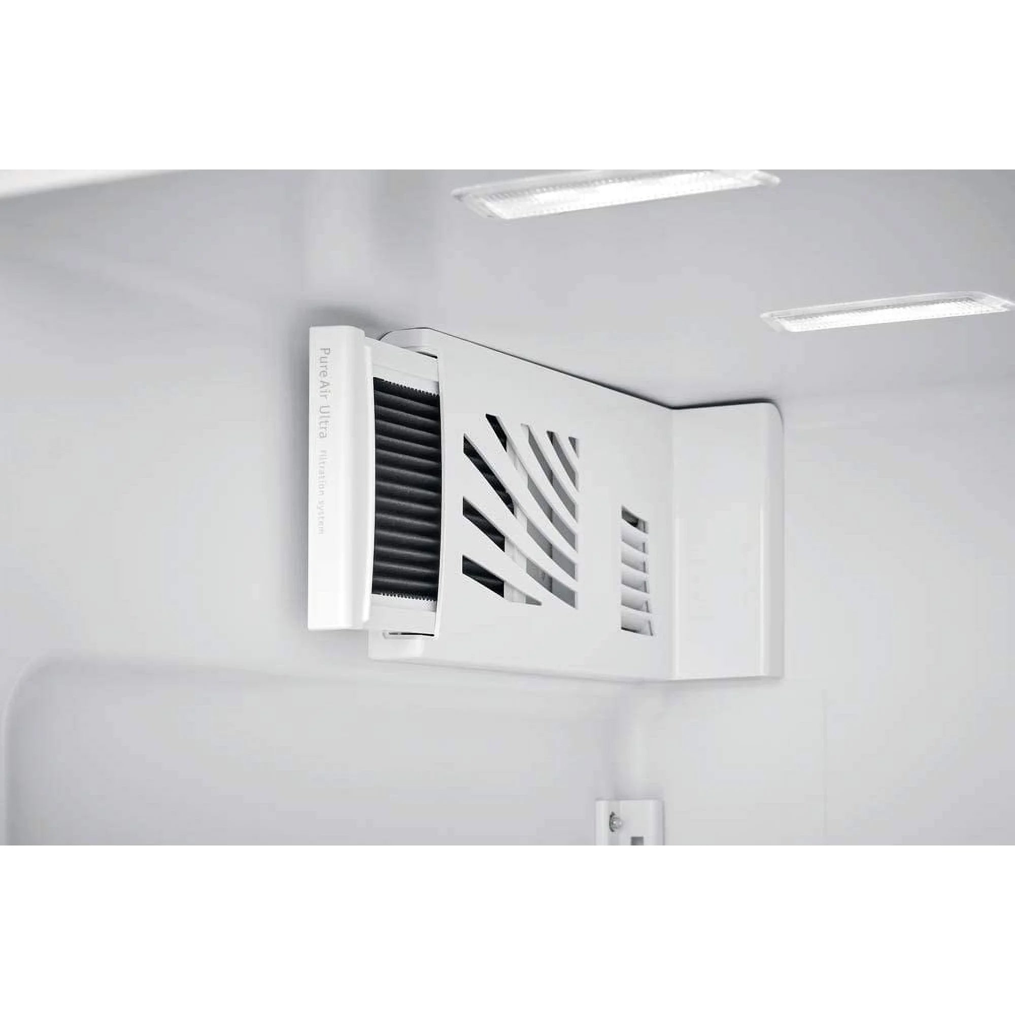 Ventilation grille on a white wall with lights above
