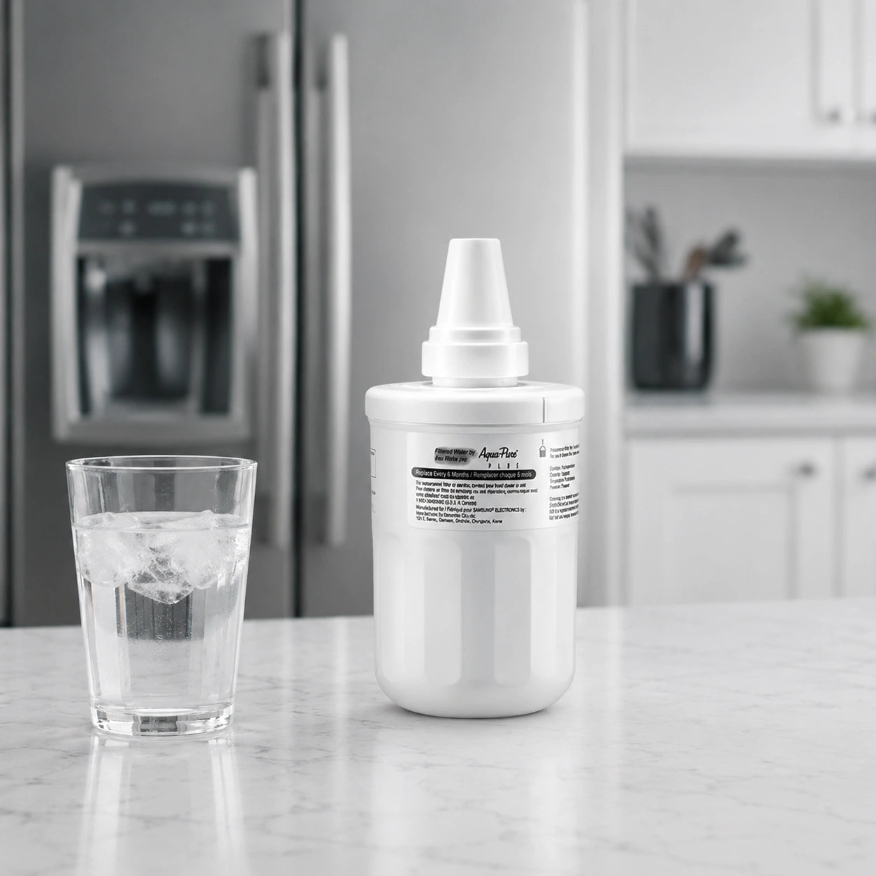 Samsung DA29-00003F refrigerator water filter displayed on kitchen counter beside a glass of ice water with modern refrigerator background for clean fresh filtered drinking water concept

